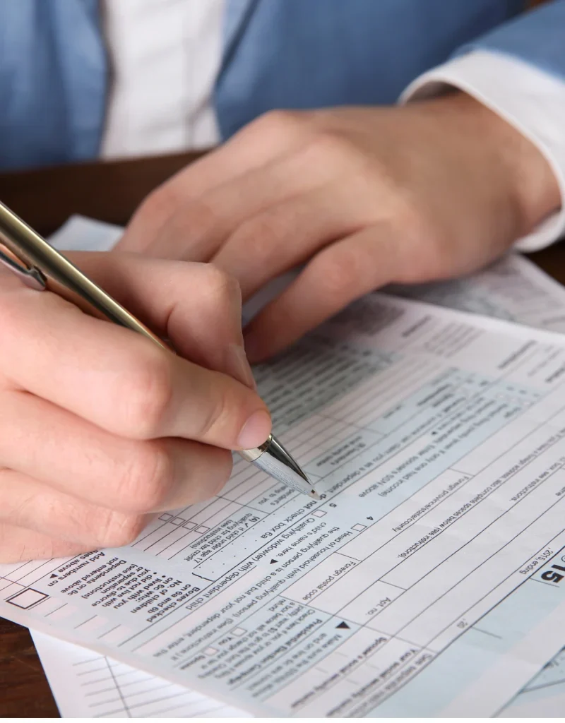 Person completing a tax form